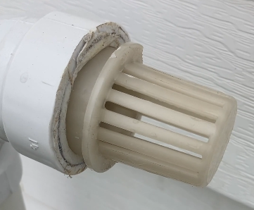“LGQF-LL 2-inch PVC vent cap with 304 stainless steel mesh preventing blocked vents and ensuring proper airflow on Carrier furnace vent pipe”