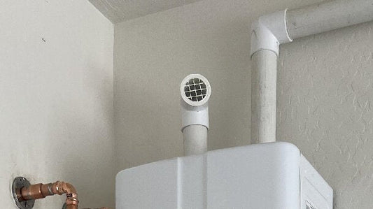 “LGQF-LL 304 stainless steel PVC vent caps installed on tankless water heater exhaust and intake vents to prevent blocked airflow, debris, and bird intrusion”