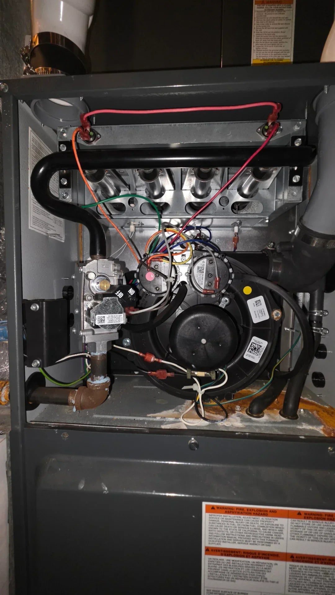 Diagram showing a high-efficiency Goodman furnace with PVC intake and exhaust pipes, illustrating common blockage points like bird nests or ice buildup for HVAC airflow troubleshooting.
