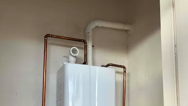 Why Your High-Efficiency Gas Water Heater Keeps Shutting Down (And How a $20 Fix Saves Your HVAC)