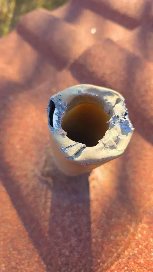 Image showing a 304 stainless steel vent cap installed on a PVC vent pipe, protecting a home from roof leaks.