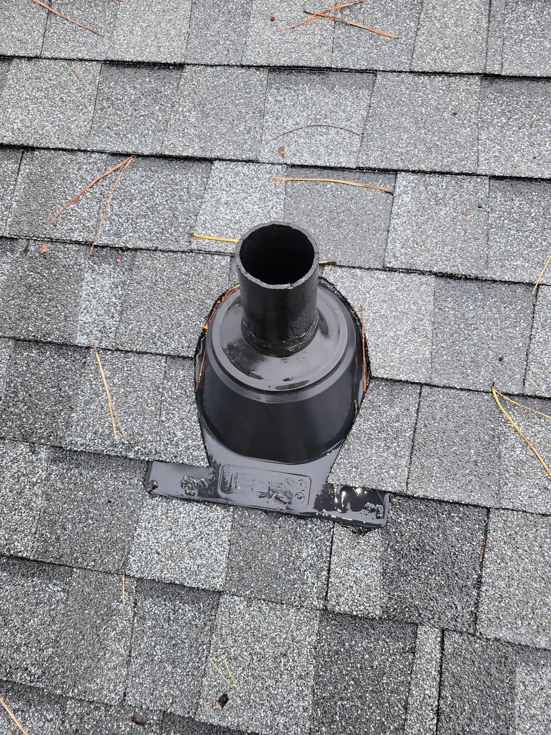 Image of a 304 stainless steel vent cap installed on a PVC vent pipe to prevent roof leaks.