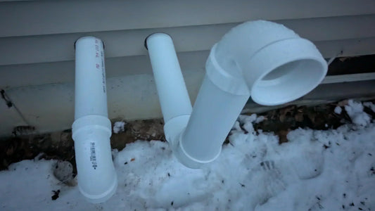 “LGQF-LL 304 stainless steel 2-inch PVC vent screen cap installed on a tankless propane water heater exhaust and intake pipes to prevent blocked airflow, debris, and animal intrusion”
